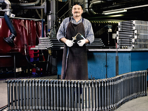 production hall working man standing infront of zehnder charleston 